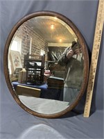Oval, beveled mirror