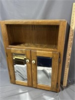 Small cabinet with mirrored doors