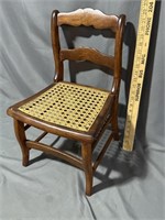 Antiques child’s chair with cane seating