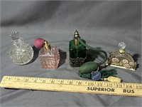 Four vintage perfume bottles