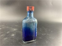 Antique bottle of Mrs. Stewart's bluing, with liqu
