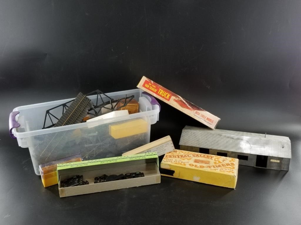 Assorted vintage and antique toy train parts