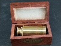 Brass ship's spyglass in wood box, expands to abou