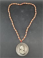 Modern Abraham Lincoln medallion on new trade bead