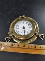 Port hole style desktop clock, battery required