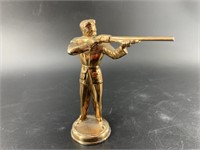 The topper to a vintage military shooter's trophy