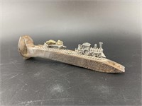 Railroad spike with pewter mine carved and tracks
