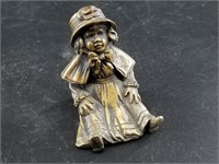 Small Bronze figurine of a seated child, 1.5" tall
