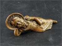 Small bronze of a resting child 3.5" long