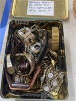 Watch lot in metal tin