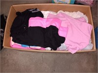 Box of clothes shirts pants tops and more