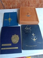 3 navy books and a navy wooden box.