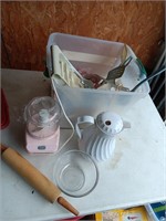 Bin of  kitchen items, rolling  pin and more.