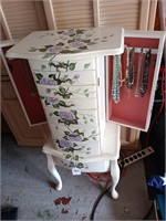 Jewelry armoire with contents mirror is loose.