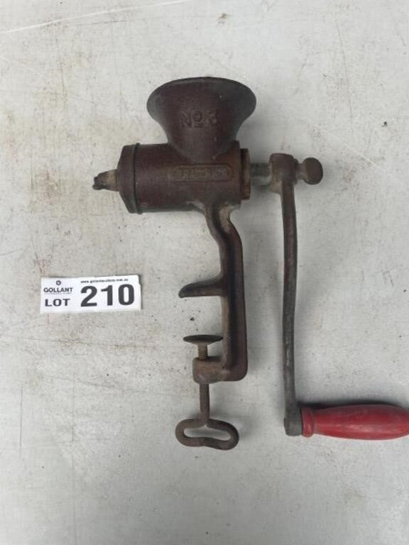 Cast iron hand-wound bench grinder.