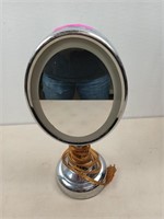 Eliminated magnifying vanity mirror, works