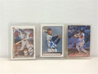Three autographed baseball cards one Gonzalez,