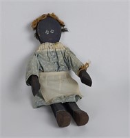 Vintage black doll made of wood with Fairfield dre