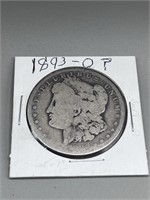 O Morgan Silver Dollar, it's and 1890's but worn a