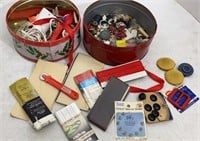 Tins of buttons and sewing notions