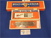 TWO VINTAGE LIONEL TRAIN CARS AND STATION
