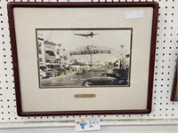 PHOTOPRINT OF PLANE FLYING OVER OLD RENO ARCH