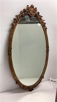 Oval mirror with carved frame, damage to top,
