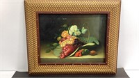 Still life picture of grapes and flowers in