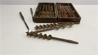 Vintage drill bits in a damaged wooden box,