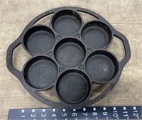 Lodge cast-iron muffin pan, a little dusty but in