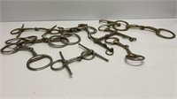 (9) silver toned horse bits