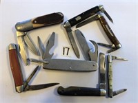7 Assorted Pocket Knives all carry some damage