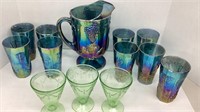 Carnival glass pitcher, 7 glasses and 3 green uv