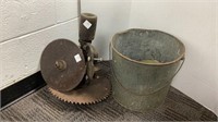 Vintage belt driven saw with metal bucket and