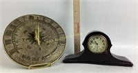 Wooden mantle clock.  Gold colored metal sun dial