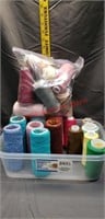 Small tote of thread of different kinds.