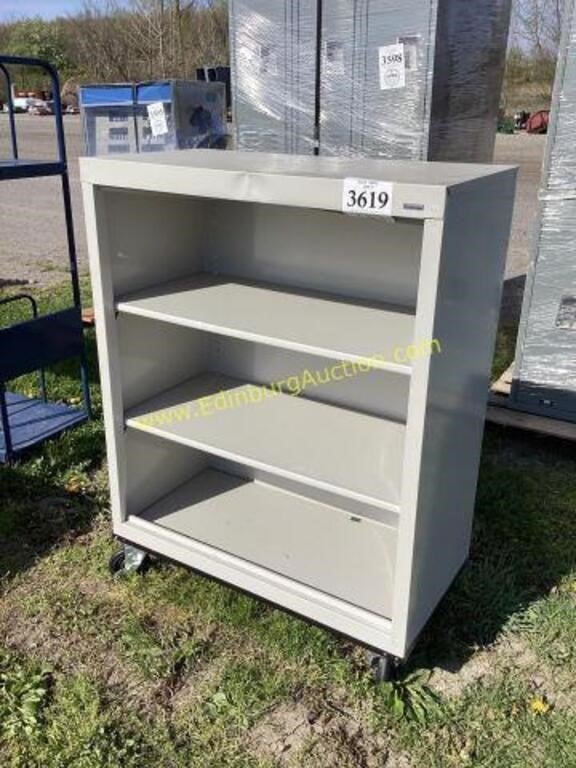 D2. 3 shelf metal 36” wide bookcase on castors