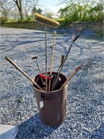 Garbage Can with Garden Tools