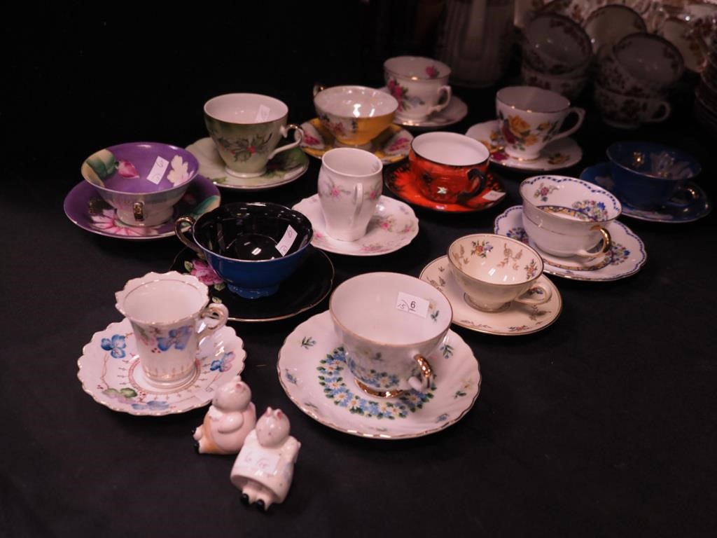 13 decorative cups and saucers, mostly