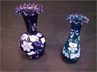 Two blue vases, both with white handpainted