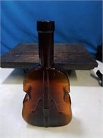Violin glass bottle possibly an old liquor bottle