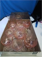 Flat of 14 pieces of pink depression glass