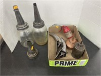 Antique oil bottle and cans