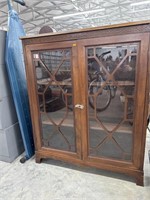 Antique glass front china cabinet
