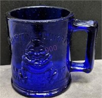 Humpty Dumpty blue glass mug
