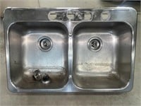 Stainless steel two-sink basin. Approx. 31” x