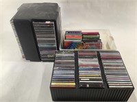 Large Assortment of Music CDs With Storage