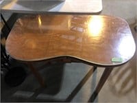 Wooden table with glass table top