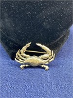 Gold tone crab brooch