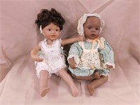 2 porcelain dolls w/ glass eyes